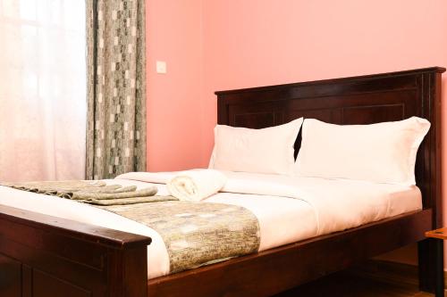 Postel nebo postele na pokoji v ubytování Cozy 2 bedroom house near Rupa