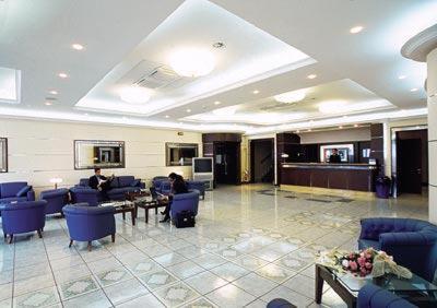 a lobby with people sitting at tables and chairs at Gli Dei in Pozzuoli