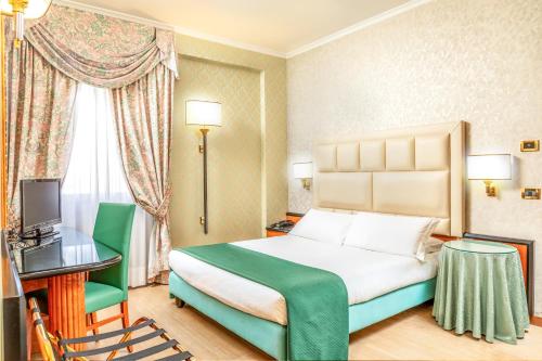 Ένα ή περισσότερα κρεβάτια σε δωμάτιο στο Hotel Principe