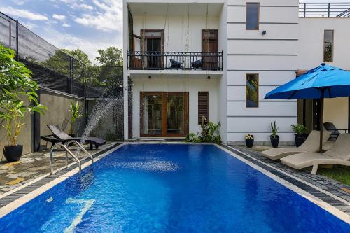 a swimming pool in the backyard of a house at Sapphire Escape - Private Villa in Ambalangoda in Ambalangoda