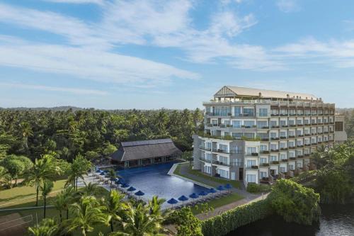 an aerial view of a resort building with a pool at Sheraton Kosgoda Turtle Beach Resort in Bentota