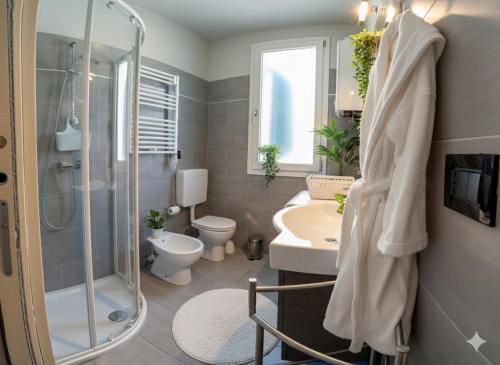 a bathroom with a shower and a toilet and a sink at Il Sole Di Bruno in Imperia