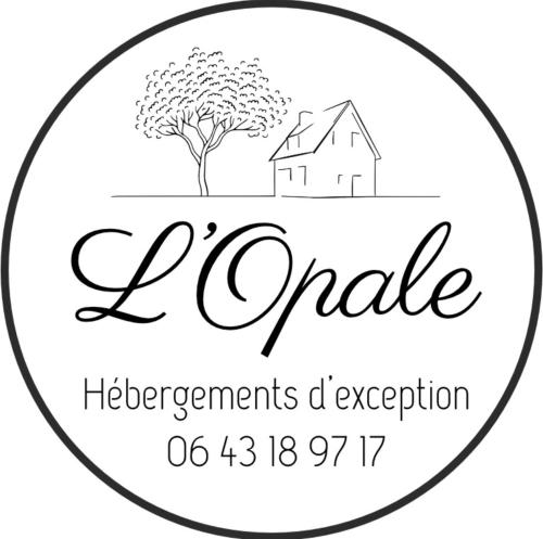 a label for a cottage with a tree and a house at L'Opale - Le White in Les Attaques