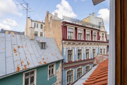 a view of the roofs of buildings at Old Town Gem - Rooftop Studio - By Innorental in Rīga