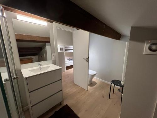 a bathroom with a sink and a toilet in a room at Immodelpas Mundial in Pas de la Casa