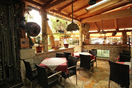 a restaurant with tables and chairs in a room at Apartments by the sea Hvar - 10430 in Hvar