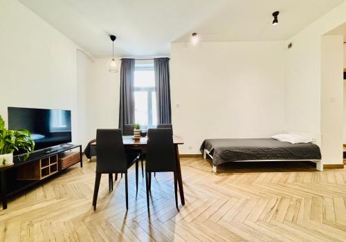 Postel nebo postele na pokoji v ubytování Apartamenty Kamienica Centrum - 1 Maja