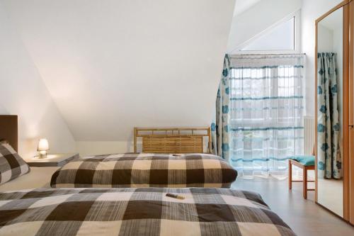 Postel nebo postele na pokoji v ubytování Mühlerain