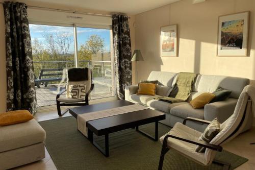 Un lugar para sentarse en Le Clos des Cigognes - Architect-designed house near Omaha Beach