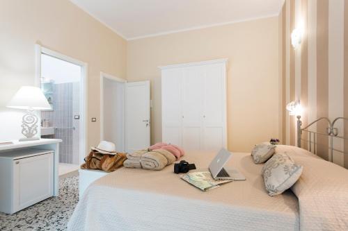 Säng eller sängar i ett rum på Casa Piazzé IUN Q0873