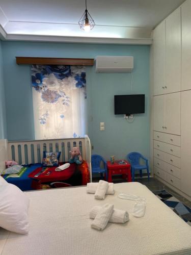 Postel nebo postele na pokoji v ubytování Maria Cozy Getaway in Glyfada