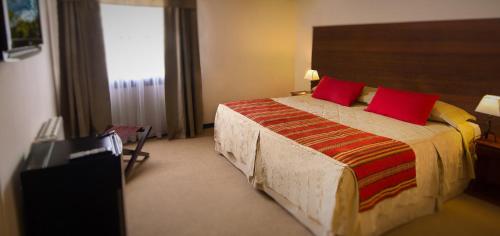 Una cama o camas en una habitación de Hotel Michelangelo