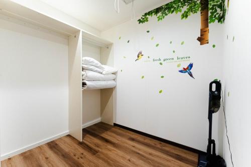 Ένα ή περισσότερα κρεβάτια σε δωμάτιο στο Dokoboko inn西本町