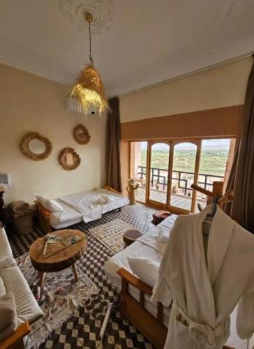 Giường trong phòng chung tại Vue panoramique Ouarzazate centre