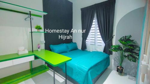 a room with a bed and a desk in it at Homestay Annur Hijrah Seri Iskandar Near UiTM ,UTP in Seri Iskandar