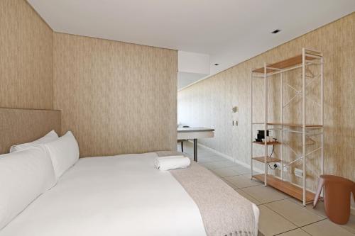 Ένα ή περισσότερα κρεβάτια σε δωμάτιο στο Kaya Stay