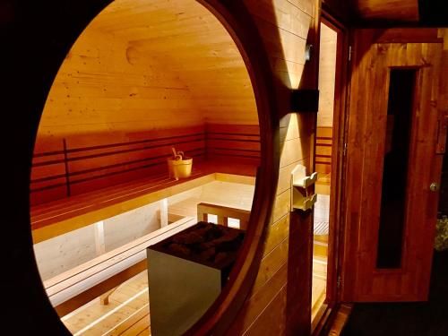 an inside view of a sauna with a bench at Traumferienwohnung Alpenliebe Sommer-Hörnerbahnen kostenlos in Bolsterlang