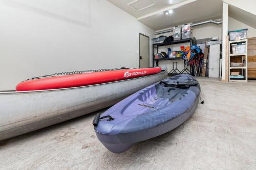 a room with two kayaks sitting on the floor at Relax & Explore Waterfront Crawford Lake Cottage 4878 in Darragh