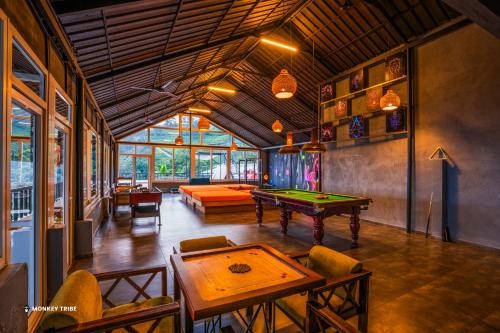 a large room with a pool table in it at Monkey Tribe Munnar in Munnar