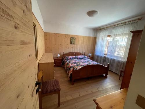 Postel nebo postele na pokoji v ubytování Nido delle Dolomiti