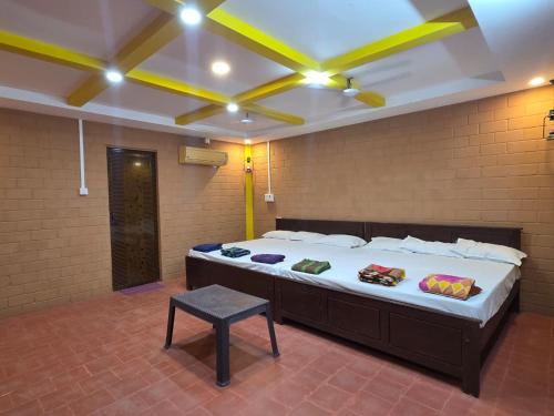 Postel nebo postele na pokoji v ubytování Mango Bite Farmstay