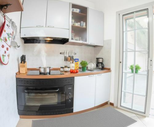 Kuchyň nebo kuchyňský kout v ubytování Aurelia Blu