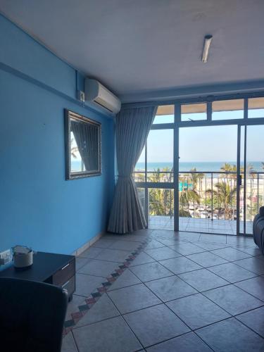 a living room with a view of the ocean at 27 on North Beach in Durban
