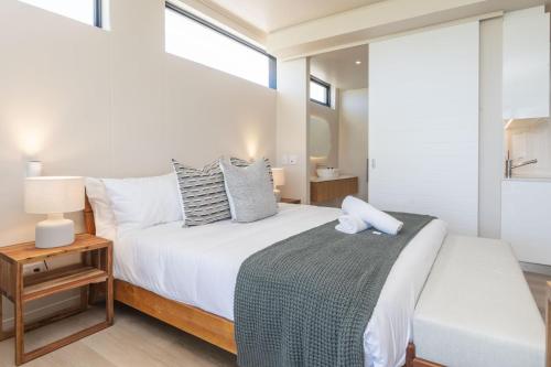 Postel nebo postele na pokoji v ubytování The Beach House Hout Bay