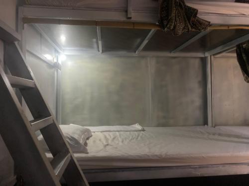 an empty bunk bed in a small room at Big J Hostel in Ninh Binh