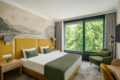 Postel nebo postele na pokoji v ubytování Portobello Wellness & Yacht Hotel Esztergom