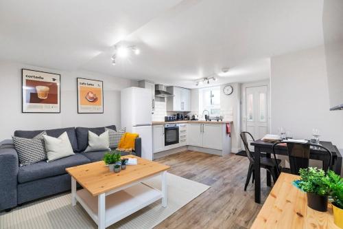 a living room with a couch and a table at Cosy One Bed Apt in Leeds City in Leeds