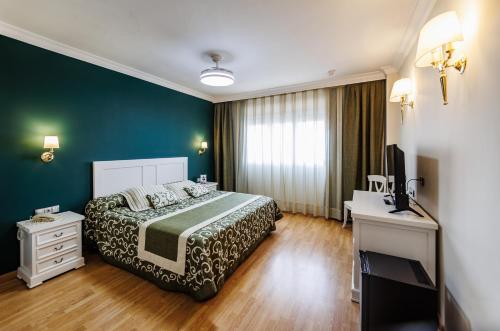Postel nebo postele na pokoji v ubytování Hotel Acosta Centro