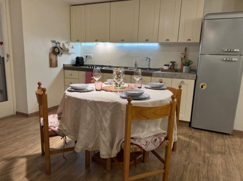 a kitchen with a table with glasses of wine at Sant'Orso Cozy Home in Cogne