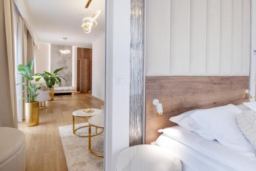 Ένα ή περισσότερα κρεβάτια σε δωμάτιο στο Hotel Magellan