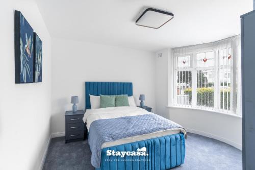 Ένα ή περισσότερα κρεβάτια σε δωμάτιο στο Spacious 4-bed Home Near Didsbury