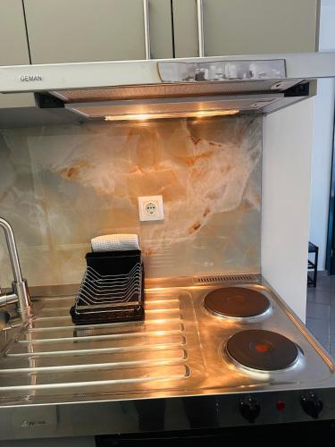 a kitchen with an oven with some food inside at Plaza di Drama in Drama