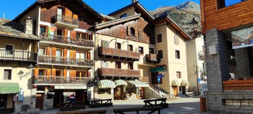 a group of buildings on a street in a town at Sant'Orso Cozy Home in Cogne