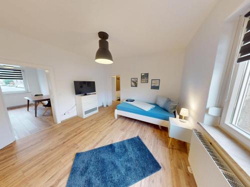 Ένα ή περισσότερα κρεβάτια σε δωμάτιο στο Ferien- und Monteurwohnung "Goitzscheluft"