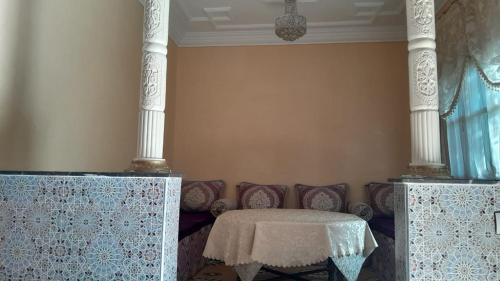 a living room with a table and a couch at Villa Tonsi in Sbiti