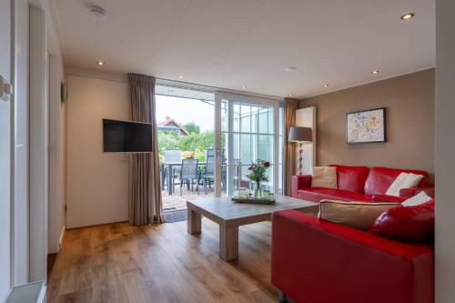 Et tv og/eller underholdning på Hello Zeeland - Holidayhome Meeuwenstein 61