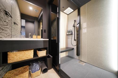 a bathroom with a shower and a sink at LinksHotel上野 in Tokyo