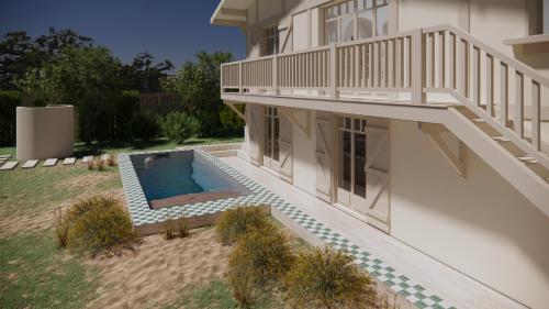 ein Haus mit einem Swimmingpool im Hof in der Unterkunft Villa d'architecte avec piscine et plage à pied in La Teste-de-Buch