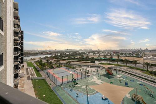 an aerial view of a water park in a city at Luxury Waters Edge Residence in Abu Dhabi
