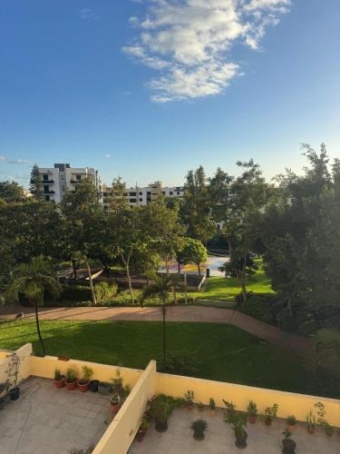 a view of a park from the balcony of a building at Ajuda Mar Holidays in Funchal