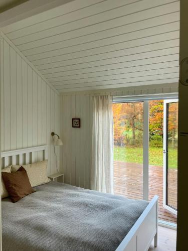 Ένα ή περισσότερα κρεβάτια σε δωμάτιο στο Modern And Idyllic Holiday Home With Forest Views