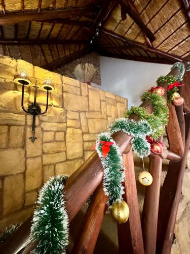 a room with christmas decorations on a wooden railing at Khaya Africa Guesthouse in Midrand