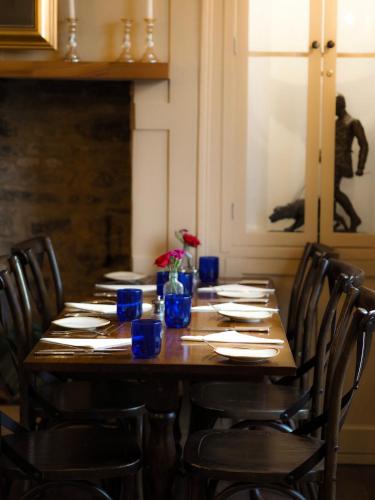 a long wooden table with chairs around it at The Seagrave Arms in Weston Subedge