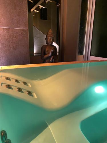 a person taking a picture of a tub in a bathroom at La Siègià Resort spa in Massa Marittima