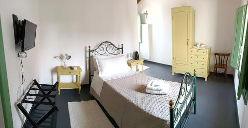 Ένα ή περισσότερα κρεβάτια σε δωμάτιο στο La Casa Vecchia