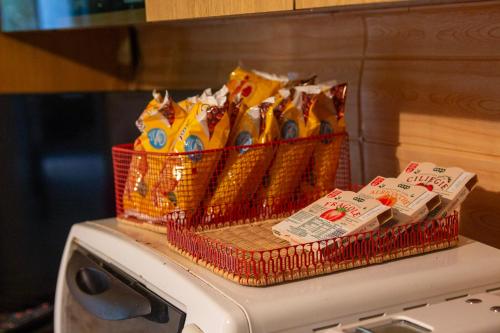 a bunch of chips in baskets on top of a microwave at Casa Vacanze Chimenti in Tarsia